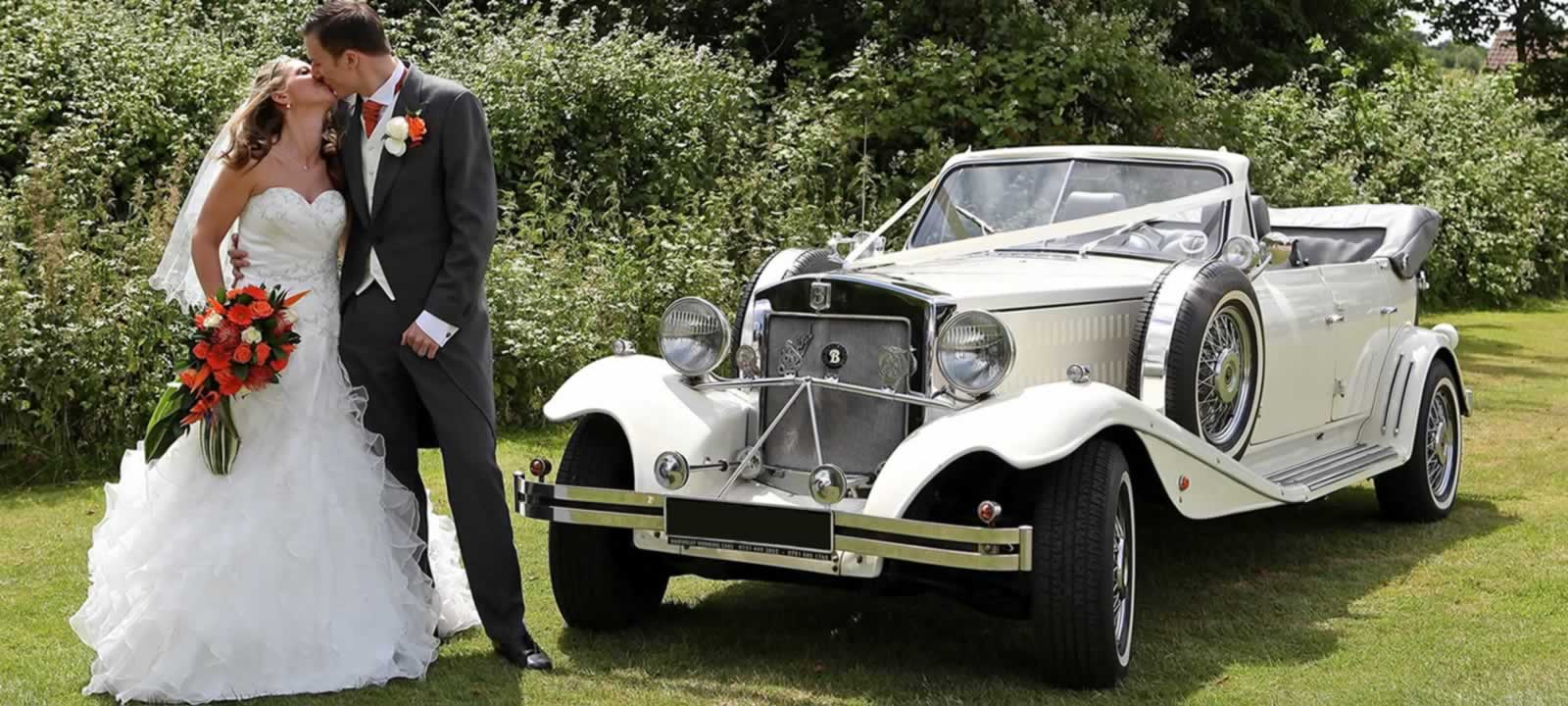 Beauford vintage open tourer wedding car with bride & groom