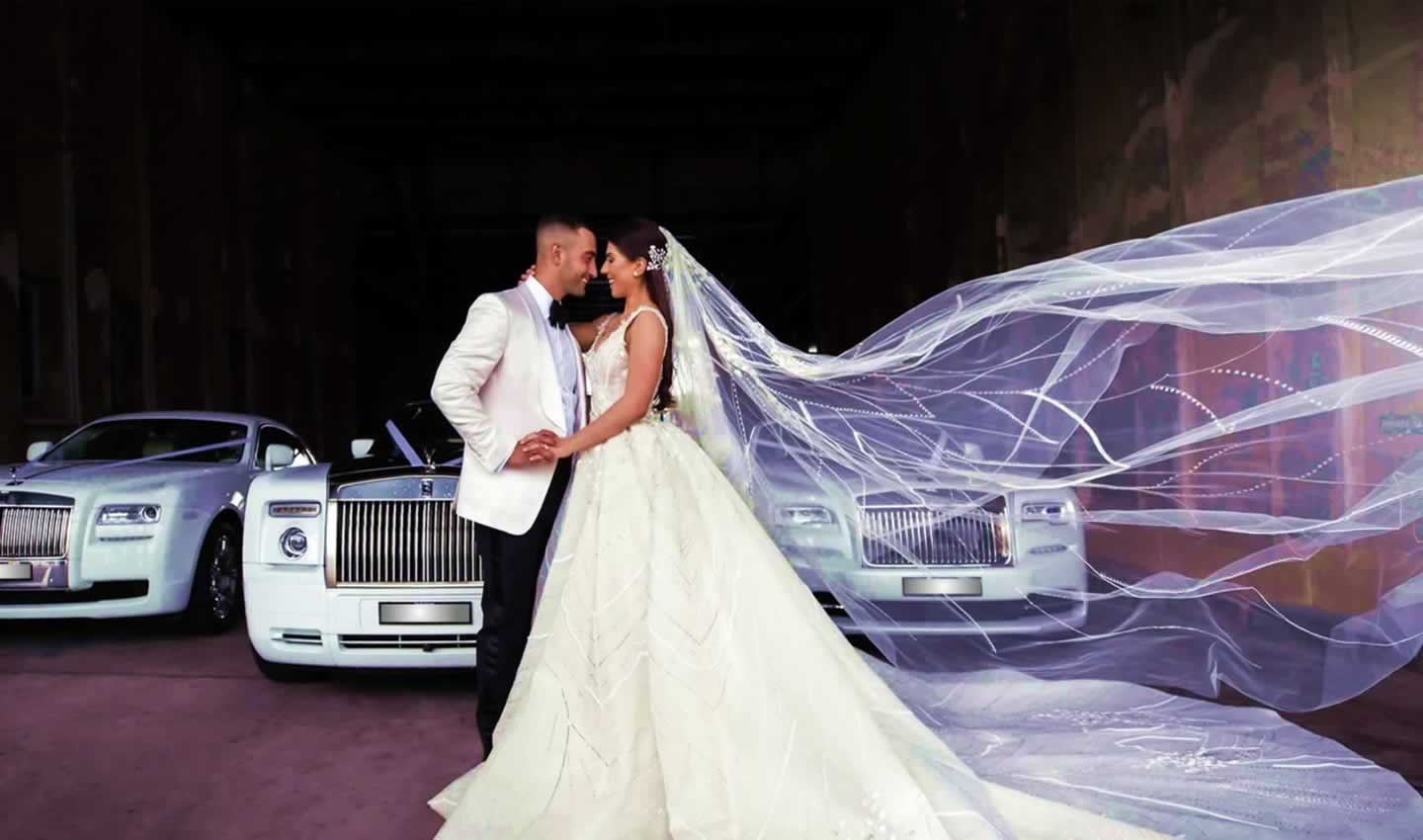 Wedding cars and limos with bride and groom