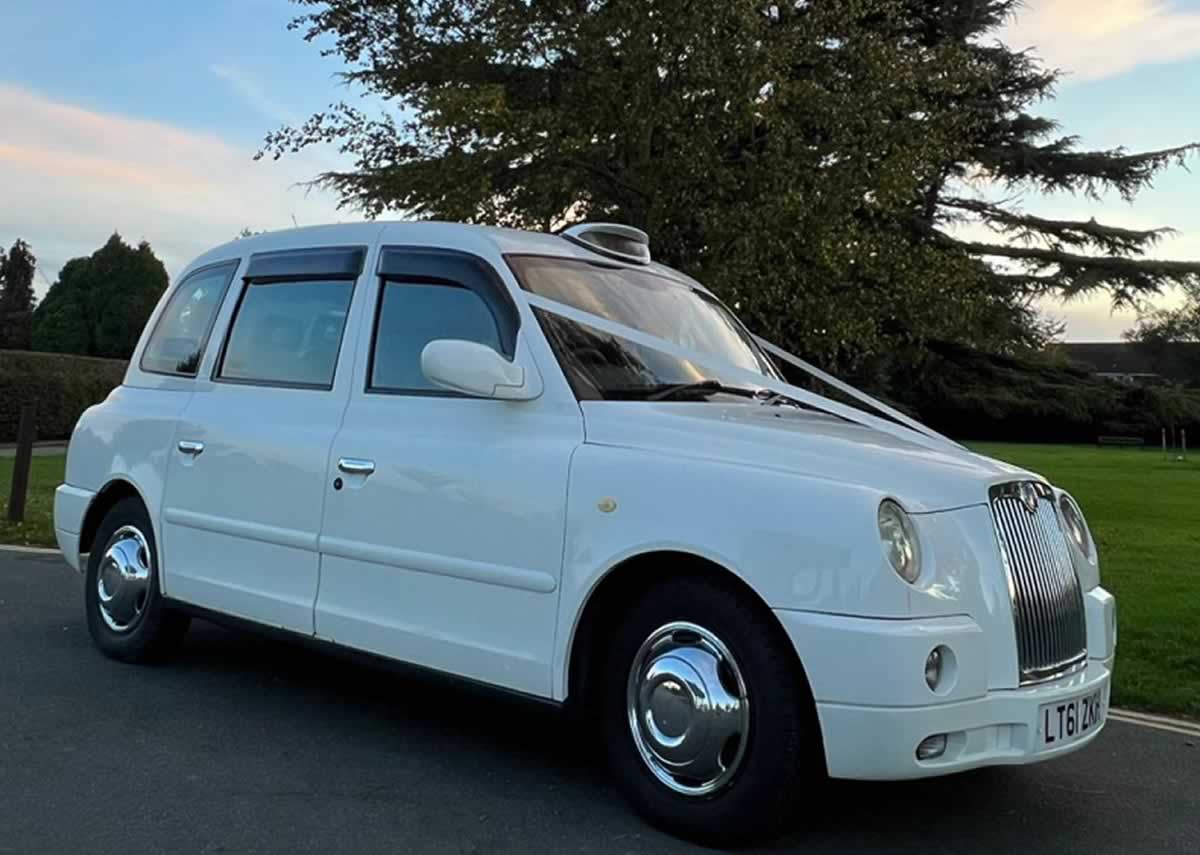 White London Taxi TX4 with wedding ribbons