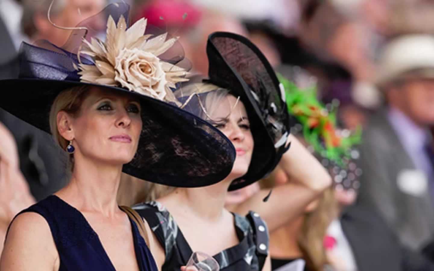 Royal Ascot Ladies Day - ladies in hats in the crowded stands at Royal Ascot