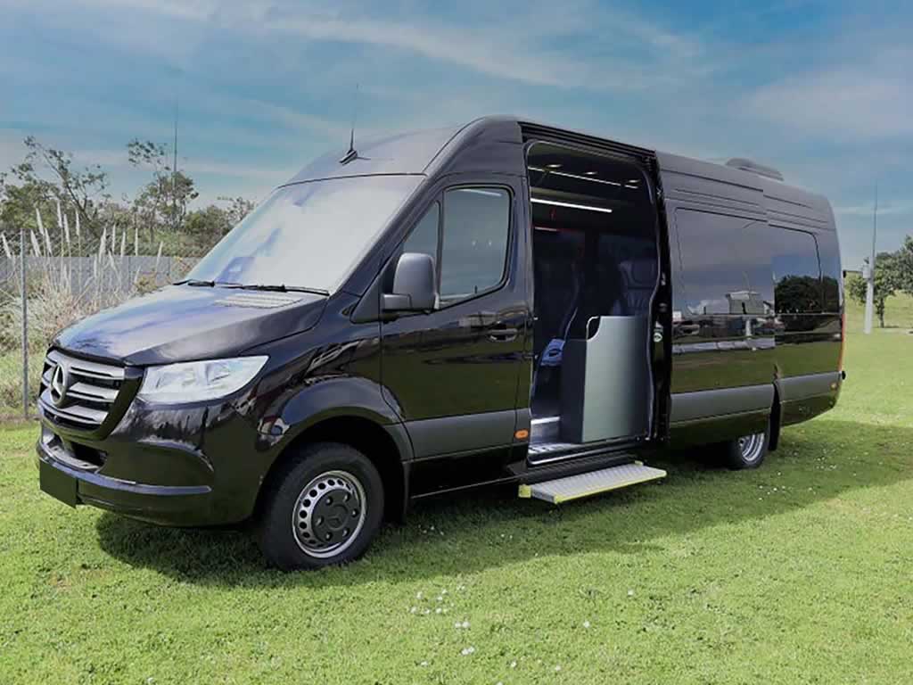 Threequarter side view of 16-seater luxury minibus